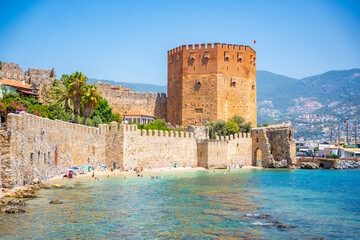 Kizil Kule or Red Tower of Alanya castle in Alanya city, Antalya Province on the southern coast of Turkey - obrazy, fototapety, plakaty