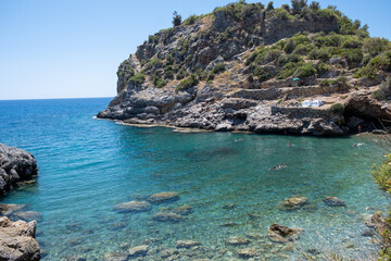 View to Mediterranean sea from the coast. Rocky sea coast covered by pines in Alanya, Turkey.