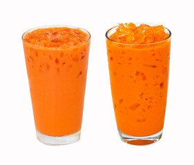 Iced milk tea color orange with crushed ice in glass on tall shape fragrant sweet two type isolated on white background. Old-fashioned tea, popular in Thailand. Refreshing drink in tropical.