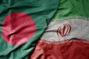big waving realistic national colorful flag of bangladesh and national flag of iran .