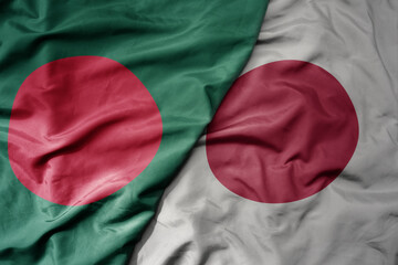 big waving realistic national colorful flag of bangladesh and national flag of japan .