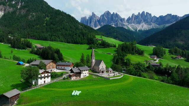 Santa Maddalena village and The Dolomites mountains in background, Val di Funes valley, Trentino Alto Adige region, Italy, Europe.