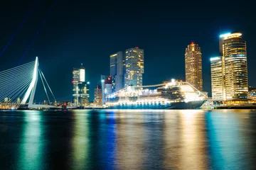 Foto auf Acrylglas Erasmusbrücke Panoramic view of the night city. Rotterdam city skyline. City towers illuminated panorama. Netherlands