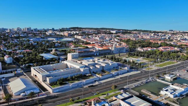 Lisbon: Aerial view of capital city of Portugal, Jeronimos Monastery (Mosteiro dos Jer&oacute;nimos) + Praca do Imperio Garden (Jardim da Pra&ccedil;a do Imp&eacute;rio) - landscape panorama of Europe from above