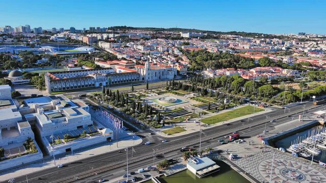 Lisbon: Aerial view of capital city of Portugal, Jeronimos Monastery (Mosteiro dos Jer&oacute;nimos) + Praca do Imperio Garden (Jardim da Pra&ccedil;a do Imp&eacute;rio) - landscape panorama of Europe from above