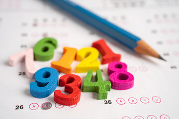 Math number and pencil on answer sheet paper, Education study testing learning teach concept.