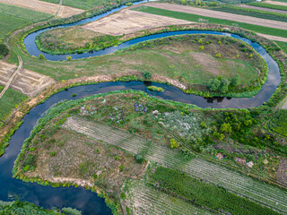 river meanders between fields