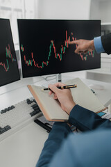 Two stock investors with stock market graph screen, stock fluctuation analysis, business man...