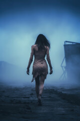 young survivor with torn clothes walking down a foggy apocalypse city.