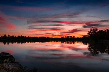 Fototapeta na wymiar Beautiful sunset over Dicosa Lake, Tarn, France