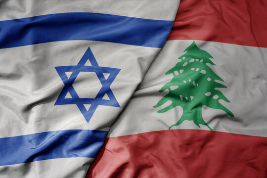 big waving realistic national colorful flag of israel and national flag of lebanon .