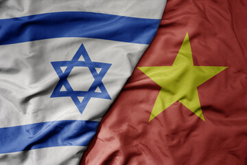 big waving realistic national colorful flag of israel and national flag of vietnam .