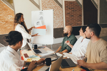 Group of young people designers having meeting in a modern office.