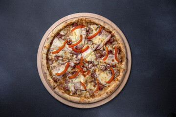 Italian cuisine. Delicious pizza on a dark background