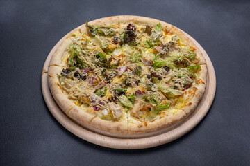 Italian cuisine. Delicious pizza on a dark background