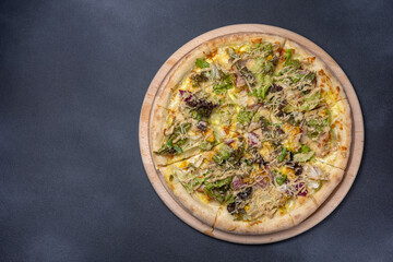 Italian cuisine. Delicious pizza on a dark background