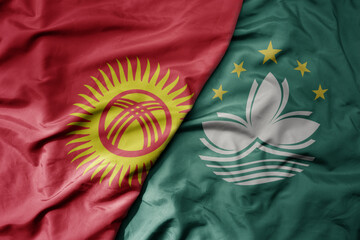 big waving realistic national colorful flag of kyrgyzstan and national flag of Macau .