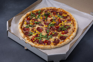 Italian cuisine. Delicious pizza on a dark background