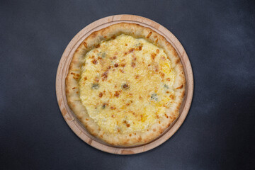 Italian cuisine. Delicious pizza on a dark background