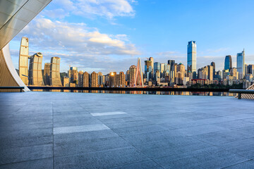 Empty square floor and skyline with modern buildings in Chongqing at sunset, China.
