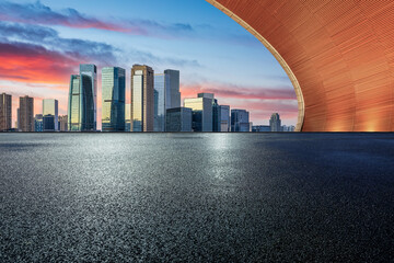 Asphalt road and urban skyline with modern buildings scenery