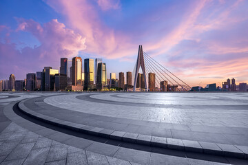 City square and skyline with modern architecture at sunrise