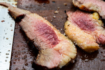 close up sliced ponta de peito, or brisket. traditional brazilian style roasted on skewer. rare doneness