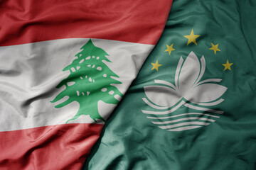 big waving realistic national colorful flag of lebanon and national flag of Macau .