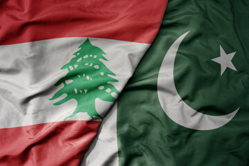 big waving realistic national colorful flag of lebanon and national flag of pakistan .