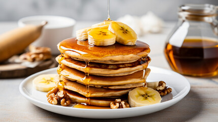 A stack of oatmeal banana pancakes topped with fresh banana slices, walnuts, and honey, accompanied by a cup of tea on a white wooden background. A nutritious breakfast. Space for copy. generative AI