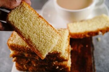 Homemade Indian butter tea cake served with cup of tea, selective focus