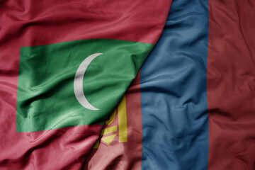 big waving realistic national colorful flag of maldives and national flag of mongolia .
