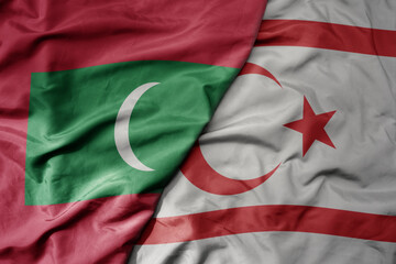 big waving realistic national colorful flag of maldives and national flag of northern cyprus .