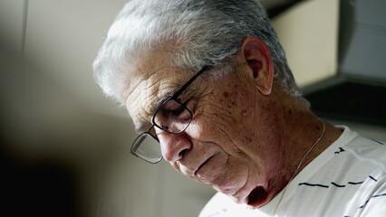 One depressed senior man closing eyes feeling regret and sorrow. Sad older male caucasian person...
