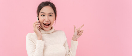 Asian beautiful woman exited surprise face expression . female feels shocked with the phone. exciting smile and happy adorable rejoices. Very enjoy and fun relax time. wow, girl holding smartphone.