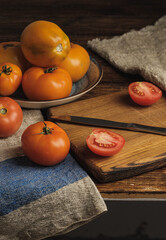 fresh tomatoes on wooden table