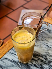 View a cup of Giang egg coffee. Vietnamese coffee in Ha Noi, Vietnam. Eggs are beaten with coffee, hot drink or with ice its famouse drink tourists must try when visit Hanoi,Vietnam.