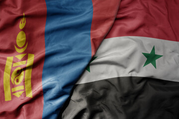 big waving realistic national colorful flag of mongolia and national flag of syria .