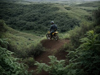 A man riding a motorcycle down a dirt road