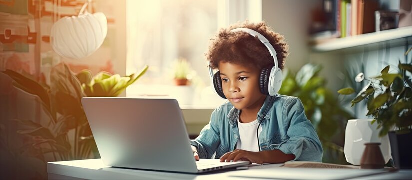 Biracial boy studying at home using technology for education