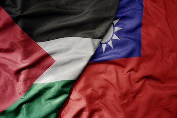Fototapeta premium big waving realistic national colorful flag of palestine and national flag of taiwan .