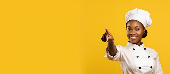 African American chef pointing at blank space for advertisement