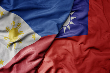 big waving realistic national colorful flag of philippines and national flag of taiwan . - obrazy, fototapety, plakaty