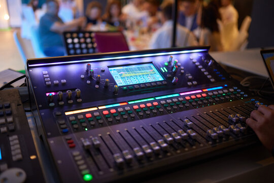 Sound mixer. Professional audio mixing console with lights, buttons, faders and sliders.