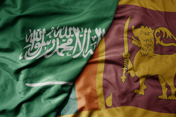 big waving realistic national colorful flag of saudi arabia and national flag of sri lanka .