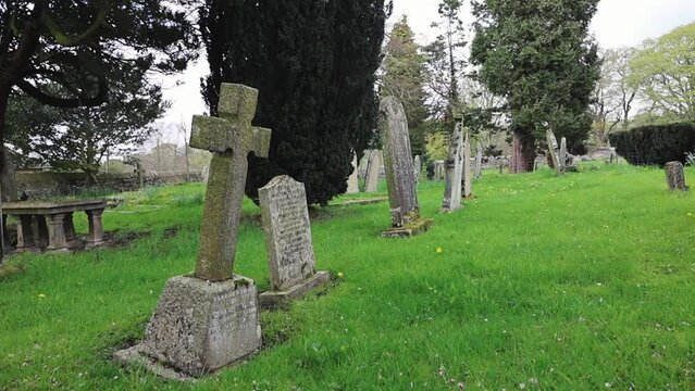 Graves With Tilted Headstones in an Old English Cemetery