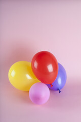 balloons in harmonious colors on a pink background
