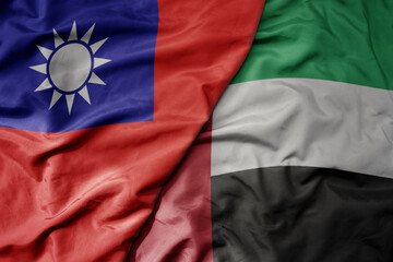 big waving realistic national colorful flag of taiwan and national flag of united arab emirates .