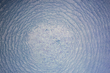 Blue water background with circle ripple