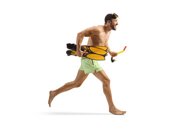 Man in swimwear holding snorkeling fins and running